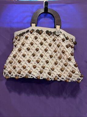 The Sak White Macramé Tote with Wooden Bead Accents
Perfect summer bag